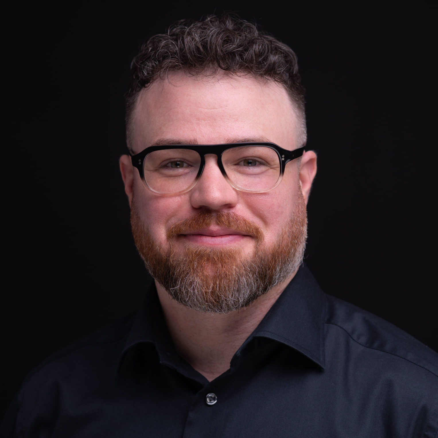 man with beard and glasses