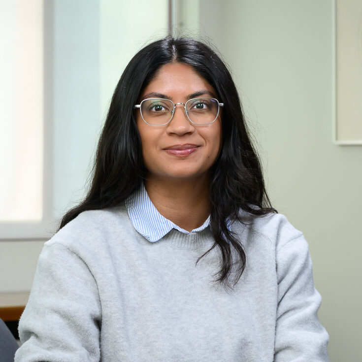 woman with glasses and dark hair